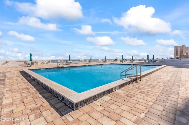 3047 S Atlantic Ave Unit 1805, Daytona Beach, FL 32118 - community pool featuring a patio area