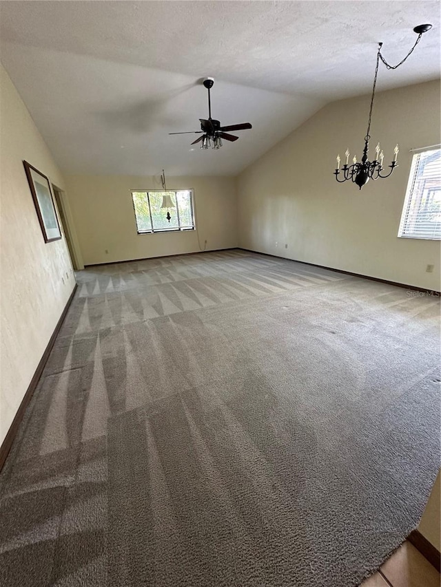 96 Old Barn Trl, Ormond Beach, FL 32174 - unfurnished room with lofted ceiling, carpet, a chandelier, a ceiling fan, and baseboards