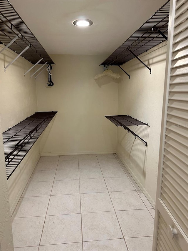 96 Old Barn Trl, Ormond Beach, FL 32174 - walk in closet featuring light tile patterned flooring