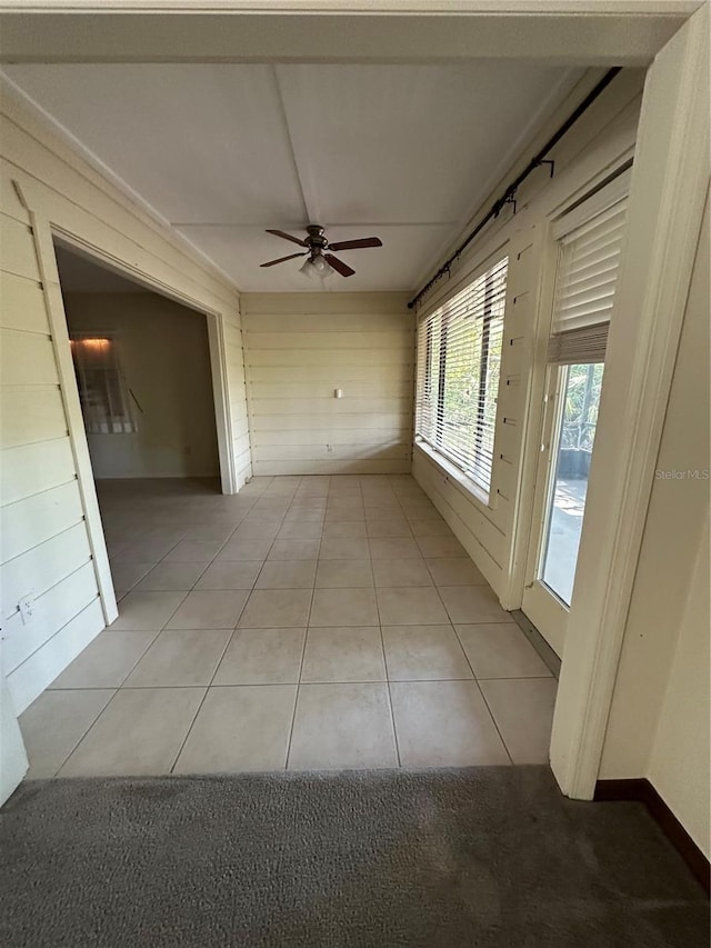 96 Old Barn Trl, Ormond Beach, FL 32174 - corridor featuring light tile patterned floors and wood walls