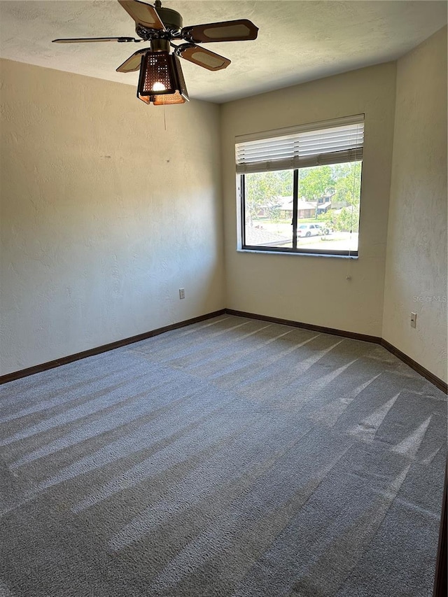 96 Old Barn Trl, Ormond Beach, FL 32174 - empty room with a textured wall, carpet flooring, baseboards, ceiling fan, and a textured ceiling