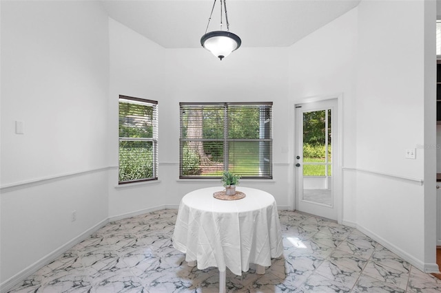 802 Royal Oak Ct, Deland, FL 32724 - dining area with light marble finish floors, healthy amount of natural light, and baseboards