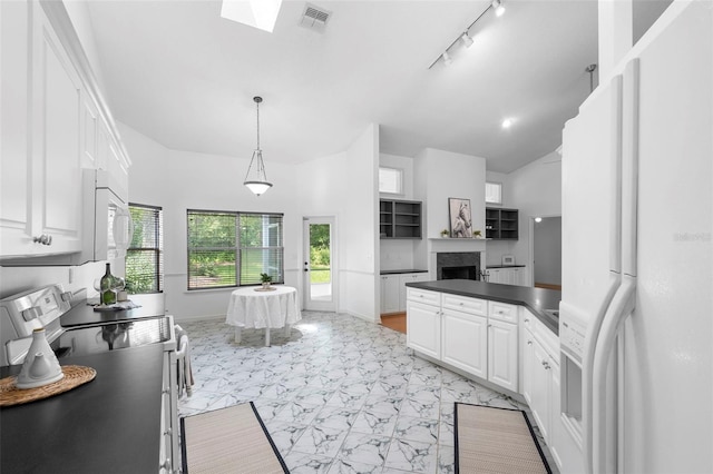 802 Royal Oak Ct, Deland, FL 32724 - kitchen featuring white appliances, a fireplace, white cabinets, dark countertops, and high vaulted ceiling