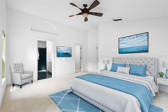 802 Royal Oak Ct, Deland, FL 32724 - bedroom with carpet floors, baseboards, ensuite bath, and ceiling fan