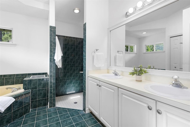 802 Royal Oak Ct, Deland, FL 32724 - bathroom with double vanity, tile patterned flooring, a garden tub, and tiled shower