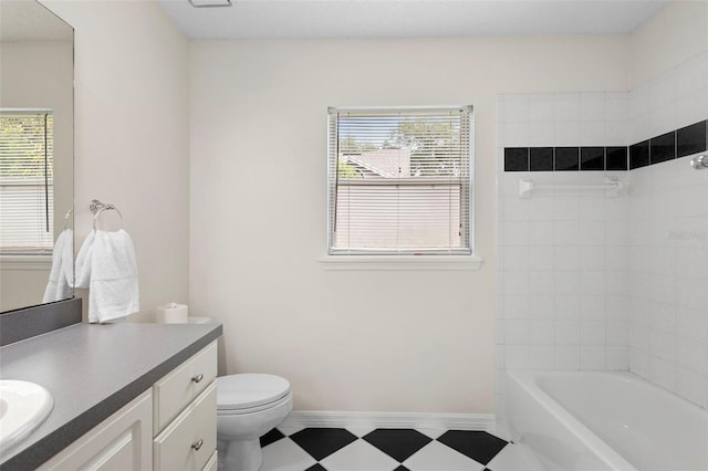 802 Royal Oak Ct, Deland, FL 32724 - bathroom with vanity, toilet, tile patterned floors,  shower combination, and baseboards
