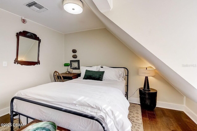 404 S Ridgewood Ave, Daytona Beach, FL 32114 - bedroom featuring wood finished floors, lofted ceiling, and baseboards