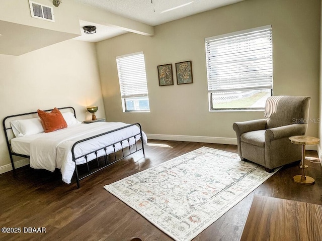 404 S Ridgewood Ave, Daytona Beach, FL 32114 - bedroom featuring baseboards, multiple windows, and dark wood-style floors