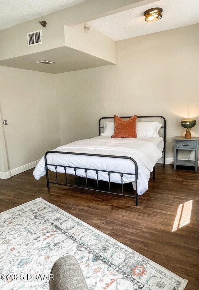 404 S Ridgewood Ave, Daytona Beach, FL 32114 - bedroom featuring wood finished floors and baseboards