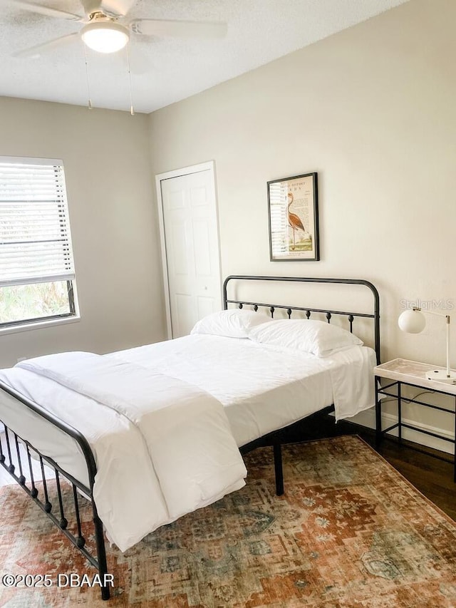404 S Ridgewood Ave, Daytona Beach, FL 32114 - bedroom featuring wood finished floors and a ceiling fan