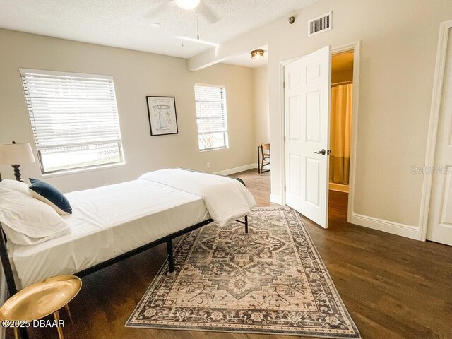 404 S Ridgewood Ave, Daytona Beach, FL 32114 - bedroom featuring wood finished floors, baseboards, and ceiling fan