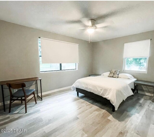 404 S Ridgewood Ave, Daytona Beach, FL 32114 - bedroom featuring wood finished floors, baseboards, and ceiling fan