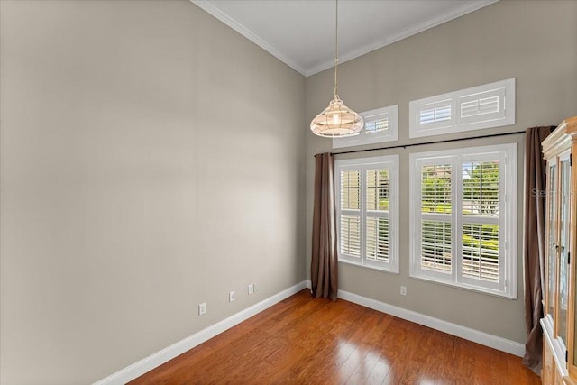 1324 Dovercourt Ln, Ormond Beach, FL 32174 - spare room with ornamental molding, baseboards, and wood finished floors