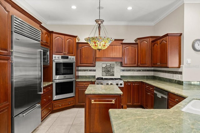 1324 Dovercourt Ln, Ormond Beach, FL 32174 - kitchen with appliances with stainless steel finishes, tasteful backsplash, a center island, decorative light fixtures, and crown molding