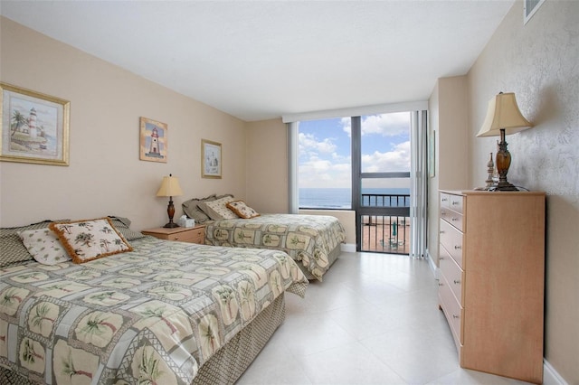 3043 S Atlantic Ave Unit 204, Daytona Beach, FL 32118 - bedroom with access to outside and a water view