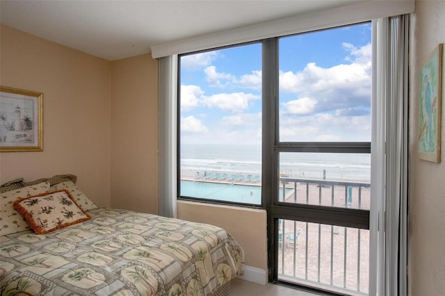 3043 S Atlantic Ave Unit 204, Daytona Beach, FL 32118 - bedroom with multiple windows and a water view