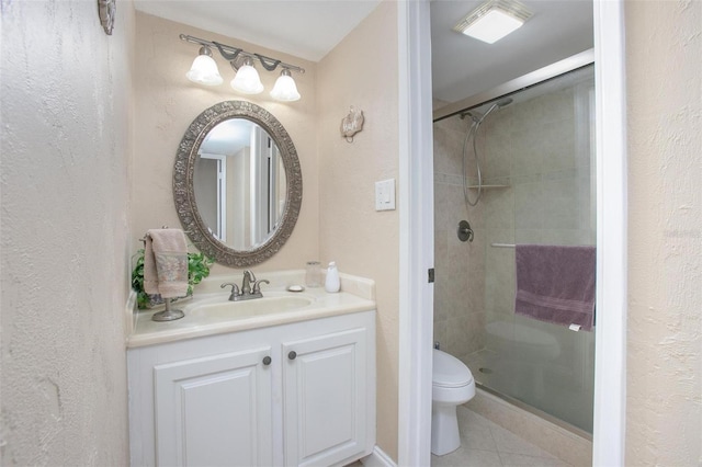 3043 S Atlantic Ave Unit 204, Daytona Beach, FL 32118 - full bathroom featuring toilet, a shower stall, vanity, tile patterned floors, and a textured wall