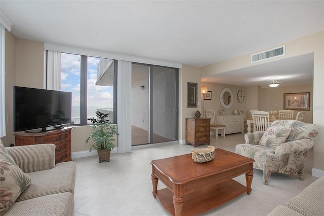 3043 S Atlantic Ave Unit 204, Daytona Beach, FL 32118 - living room featuring baseboards