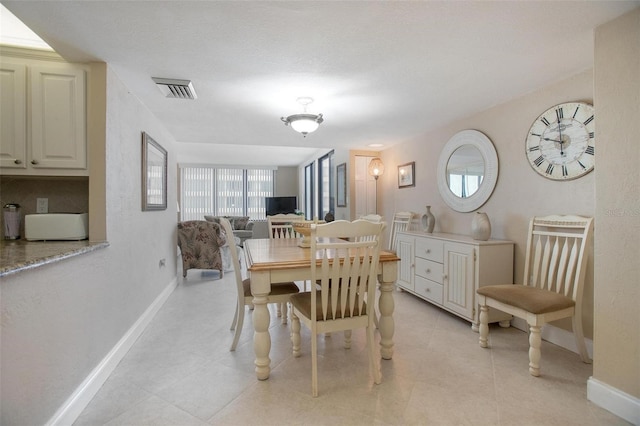3043 S Atlantic Ave Unit 204, Daytona Beach, FL 32118 - dining space featuring baseboards