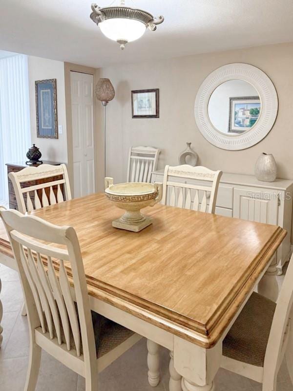 3043 S Atlantic Ave Unit 204, Daytona Beach, FL 32118 - dining space with tile patterned flooring