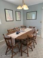 2898 Ocean Shore Blvd Unit 603, Ormond Beach, FL 32176 - dining room featuring baseboards