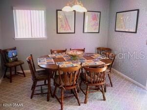 2898 Ocean Shore Blvd Unit 603, Ormond Beach, FL 32176 - dining space with baseboards