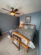 2898 Ocean Shore Blvd Unit 603, Ormond Beach, FL 32176 - bedroom with carpet floors and baseboards