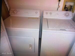 2898 Ocean Shore Blvd Unit 603, Ormond Beach, FL 32176 - laundry area with washer and dryer