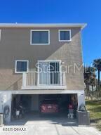 2898 Ocean Shore Blvd Unit 603, Ormond Beach, FL 32176 - back of property with a balcony and concrete driveway