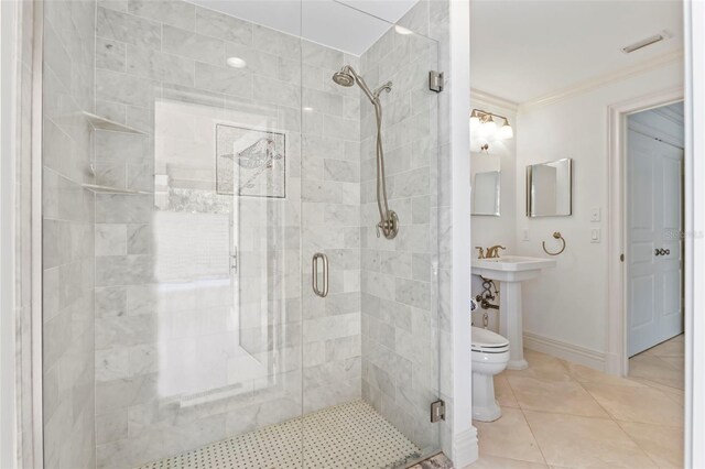 2275 Genesea Ln, Vero Beach, FL 32963 - full bath with a stall shower, ornamental molding, toilet, tile patterned floors, and baseboards
