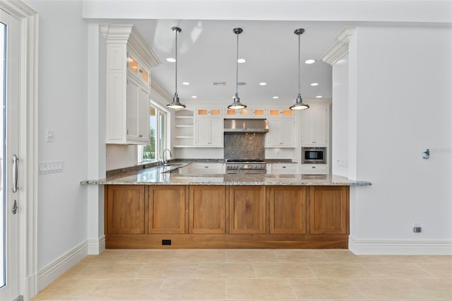 2275 Genesea Ln, Vero Beach, FL 32963 - kitchen featuring stainless steel appliances, under cabinet range hood, baseboards, tasteful backsplash, and light stone counters