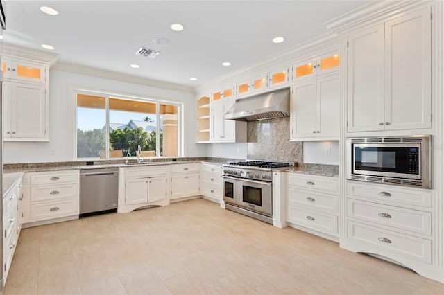 2275 Genesea Ln, Vero Beach, FL 32963 - kitchen with appliances with stainless steel finishes, under cabinet range hood, light stone counters, crown molding, and white cabinets
