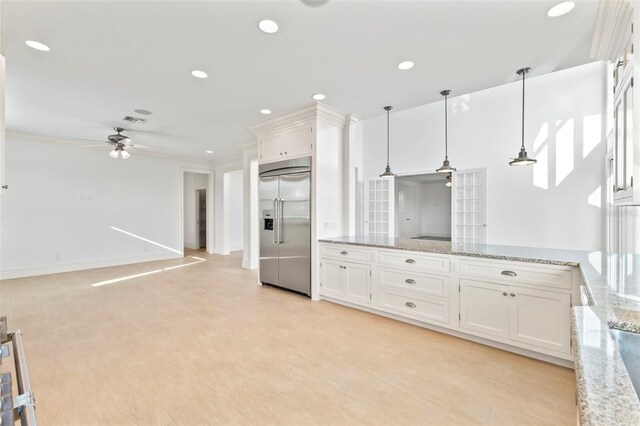 2275 Genesea Ln, Vero Beach, FL 32963 - kitchen with built in fridge, ceiling fan, white cabinetry, decorative light fixtures, and recessed lighting