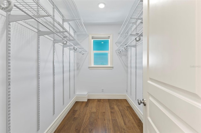 2275 Genesea Ln, Vero Beach, FL 32963 - spacious closet featuring dark wood-style flooring