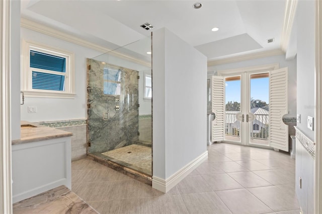 2275 Genesea Ln, Vero Beach, FL 32963 - bathroom with french doors, ornamental molding, a marble finish shower, tile patterned floors, and vanity