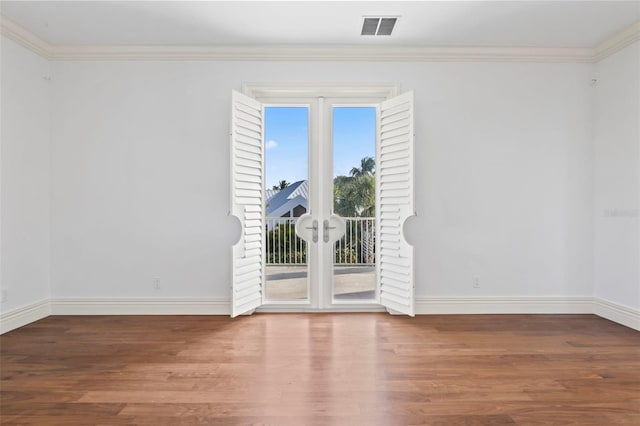 2275 Genesea Ln, Vero Beach, FL 32963 - spare room featuring baseboards, wood finished floors, french doors, and crown molding