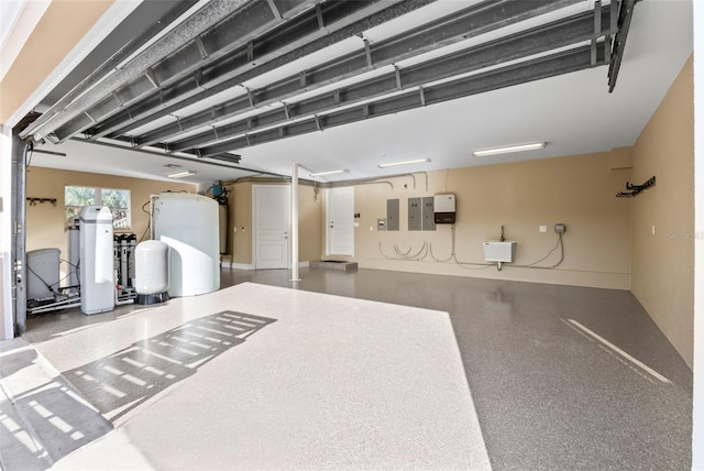 2275 Genesea Ln, Vero Beach, FL 32963 - garage featuring electric panel and baseboards