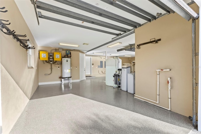 2275 Genesea Ln, Vero Beach, FL 32963 - garage featuring water heater and freestanding refrigerator