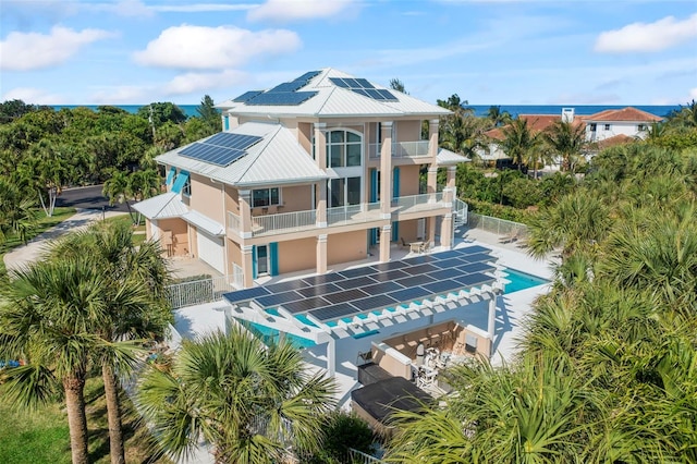 2275 Genesea Ln, Vero Beach, FL 32963 - view of building exterior with a fenced backyard and a community pool