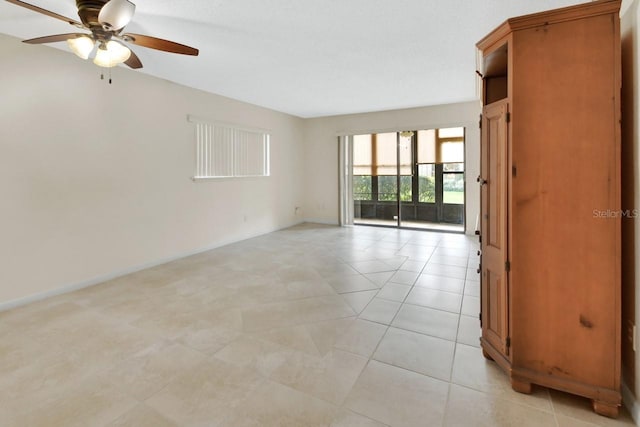 600 N Boundary Ave Unit 110A, Deland, FL 32720 - unfurnished room featuring ceiling fan, baseboards, and light tile patterned floors