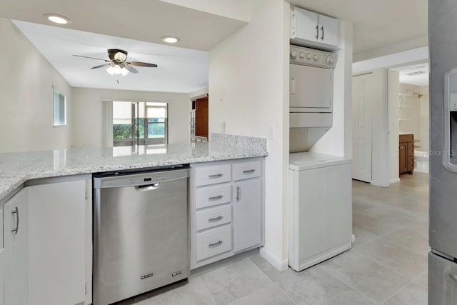 600 N Boundary Ave Unit 110A, Deland, FL 32720 - kitchen with dishwasher, stacked washer / drying machine, a ceiling fan, light stone counters, and white cabinetry