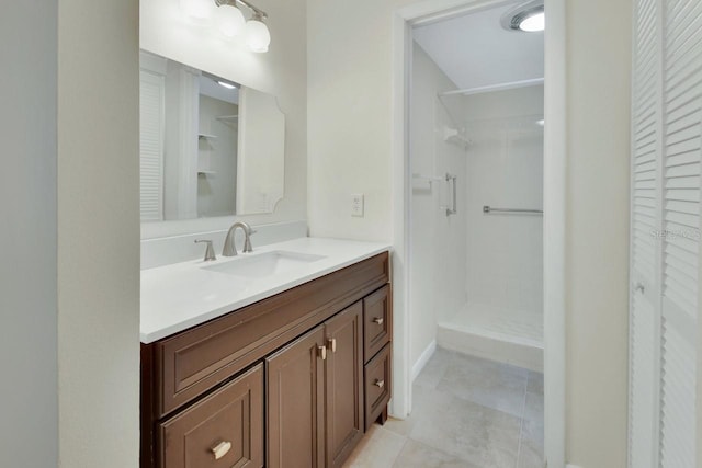 600 N Boundary Ave Unit 110A, Deland, FL 32720 - bathroom featuring a closet, vanity, walk in shower, and tile patterned floors