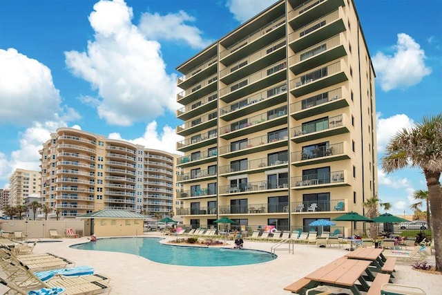 3647 S Atlantic Ave Unit 7C, Daytona Beach, FL 32118 - community pool with a patio