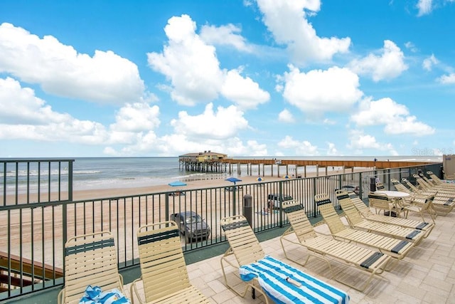 3647 S Atlantic Ave Unit 7C, Daytona Beach, FL 32118 - view of patio with view of water and beach