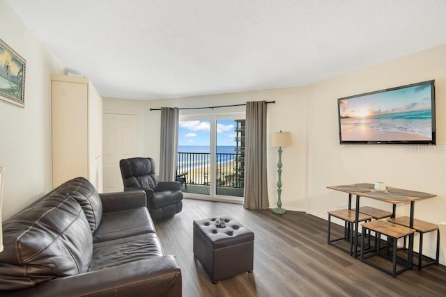 3647 S Atlantic Ave Unit 7C, Daytona Beach, FL 32118 - living area with wood finished floors and baseboards