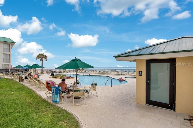 3647 S Atlantic Ave Unit 7C, Daytona Beach, FL 32118 - community pool with a patio, a yard, and a water view
