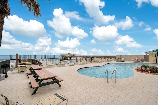 3647 S Atlantic Ave Unit 7C, Daytona Beach, FL 32118 - community pool with a patio and a water view