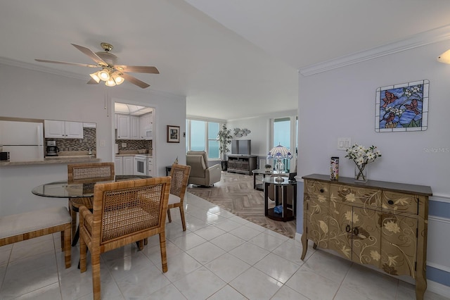 2800 N Atlantic Ave Unit 1716, Daytona Beach, FL 32118 - dining area featuring ornamental molding and a ceiling fan