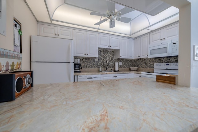 2800 N Atlantic Ave Unit 1716, Daytona Beach, FL 32118 - kitchen featuring white appliances, a sink, backsplash, and ceiling fan