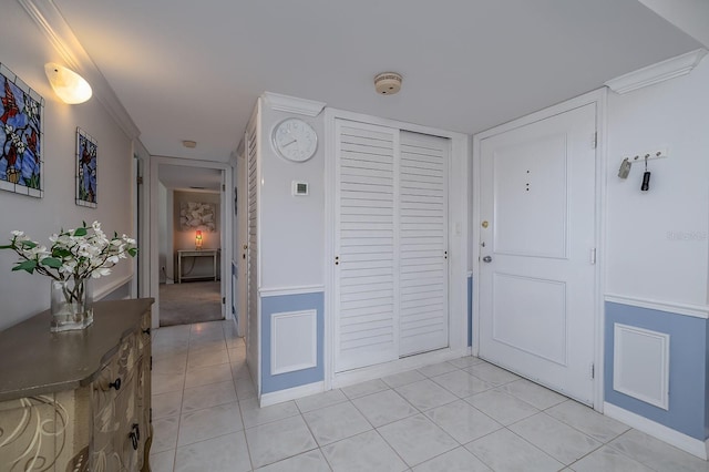 2800 N Atlantic Ave Unit 1716, Daytona Beach, FL 32118 - entrance foyer with light tile patterned floors, crown molding, and baseboards